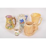 A Sylvac jug, a majolica jug, a Burleighware jug and others