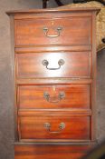 A mahogany leather topped filing cabinet