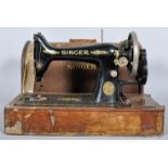 An oak cased singer sewing machine