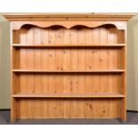 A pine three shelved dresser top with flared cornice top. Measures; 121cm x 147cm.