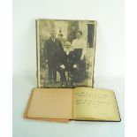 An autograph album with a watercolour sketch and a photo of the artist's mother