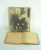 An autograph album with a watercolour sketch and a photo of the artist's mother