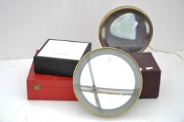 Two vanity mirrors together with display boxes for Cartier,