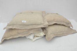 Four cushions with linen and lace