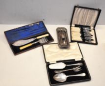 A box of silver plated knives and other items