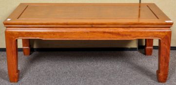 A Chinese style coffee table. Measures; 37cm x 91cm x 46cm.