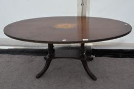A mahogany inlaid coffee table