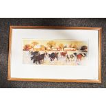 A framed and glazed print depicting cows.