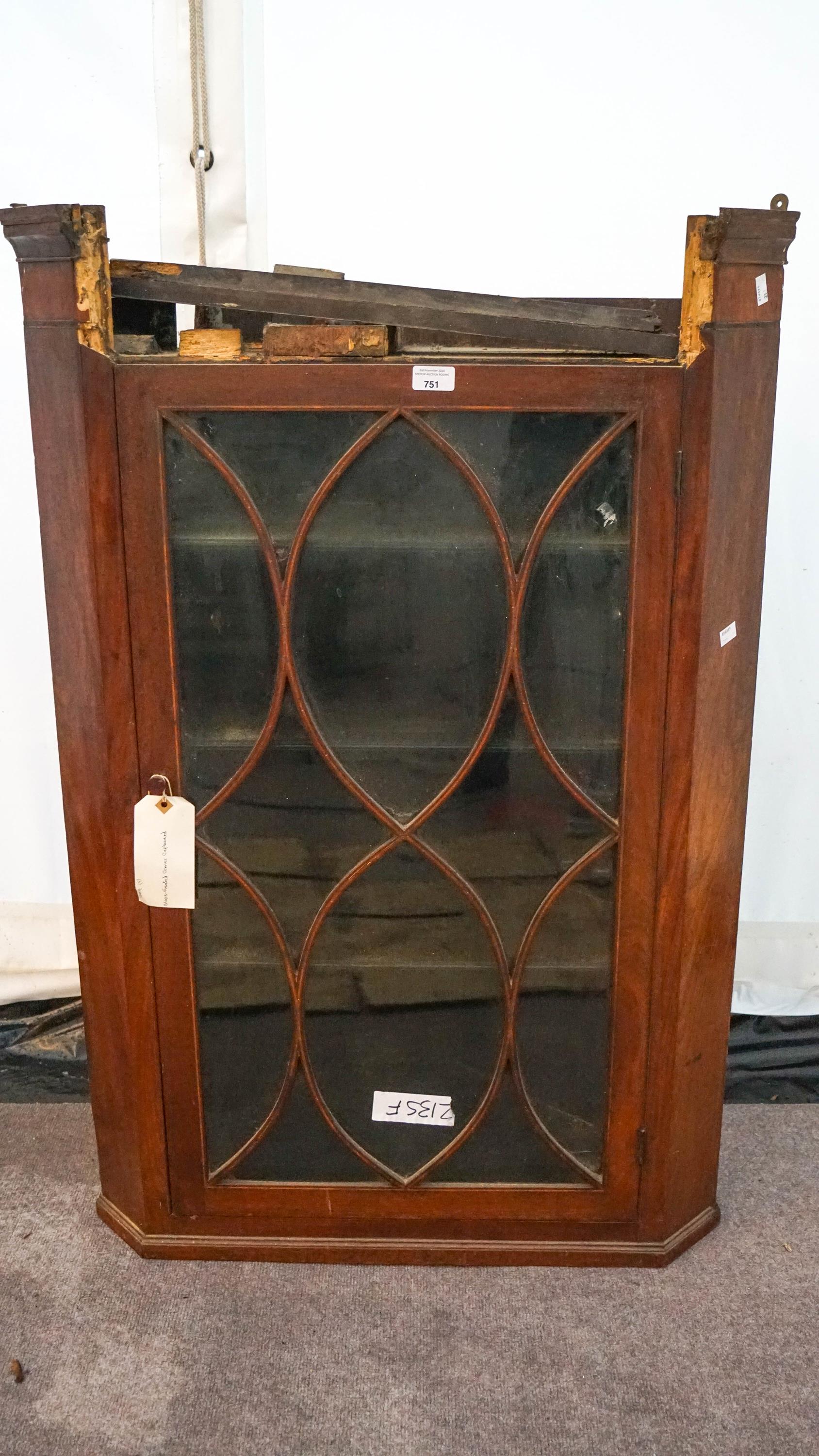 A mahogany corner cabinet