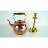 A brass candlestick and a copper kettle