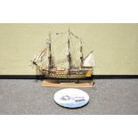 A model of HMS Victory, made from timber recovered from the ship, together with Victory certificate,