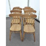 A set of eight pine kitchen chairs