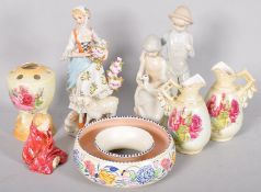 A collection of assorted ceramics and figures to include poole pottery and other items.