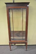 A Sheraton Revival glass fronted cabinet