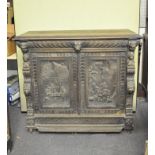 A Victorian carved oak side cabinet