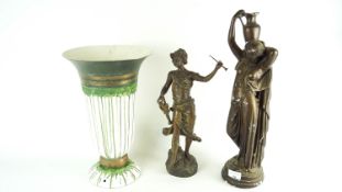 A vase light and two figures