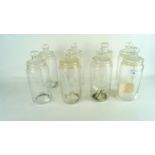 Eight glass lidded jars