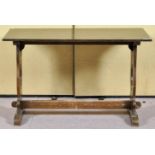 A dark oak refectory table,