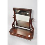 A Victorian mahogany swing mirror with drawers to base