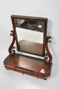 A Victorian mahogany swing mirror with drawers to base