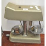A set of Omal Money Checker banking scales with weights.