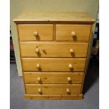 A two over four pine chest of drawers