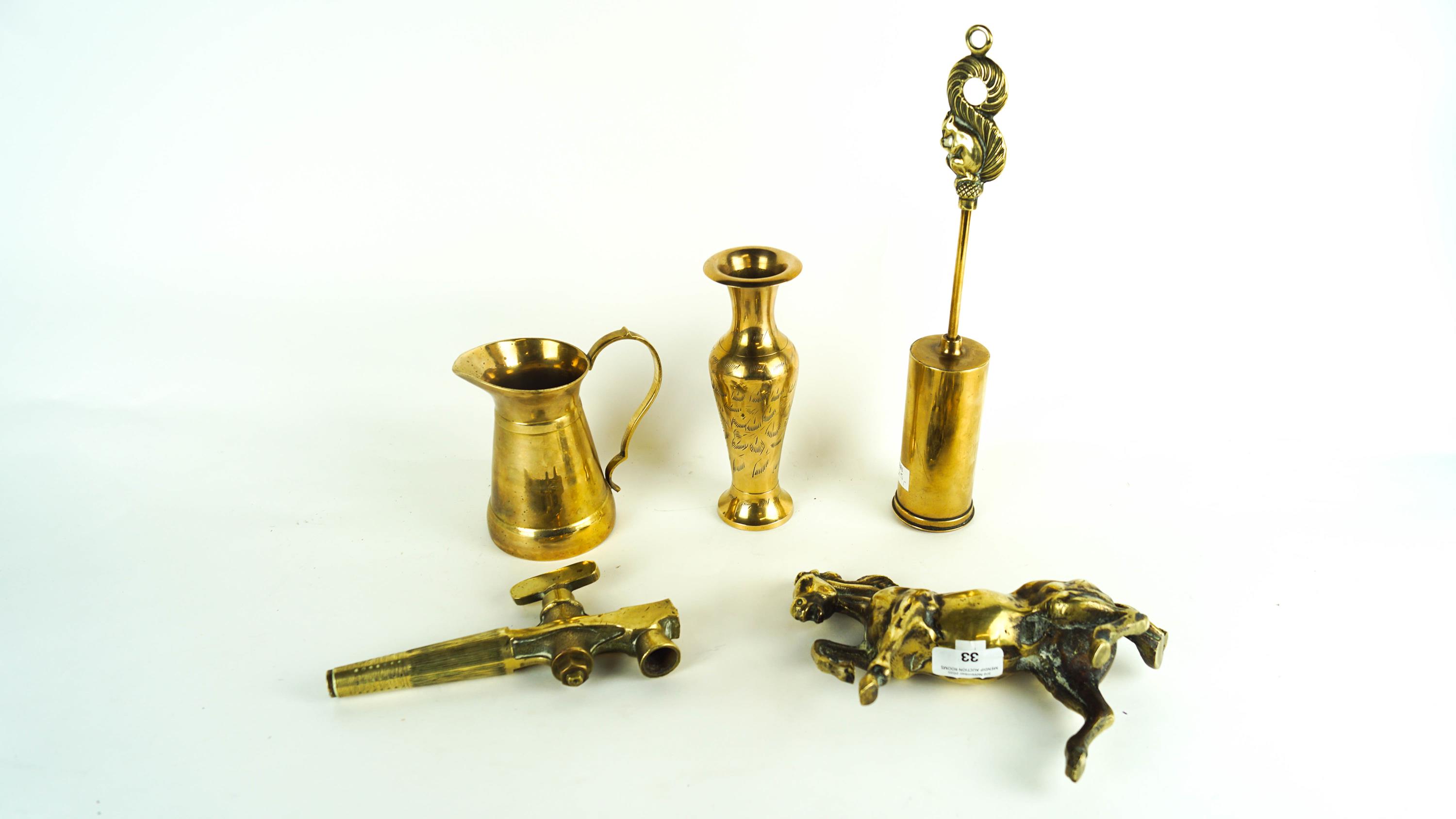 A collection of assorted brass ware to include a model of a horse, brush jug etc