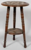 A Victorian carved wood two tier occasional table, late 19th century,