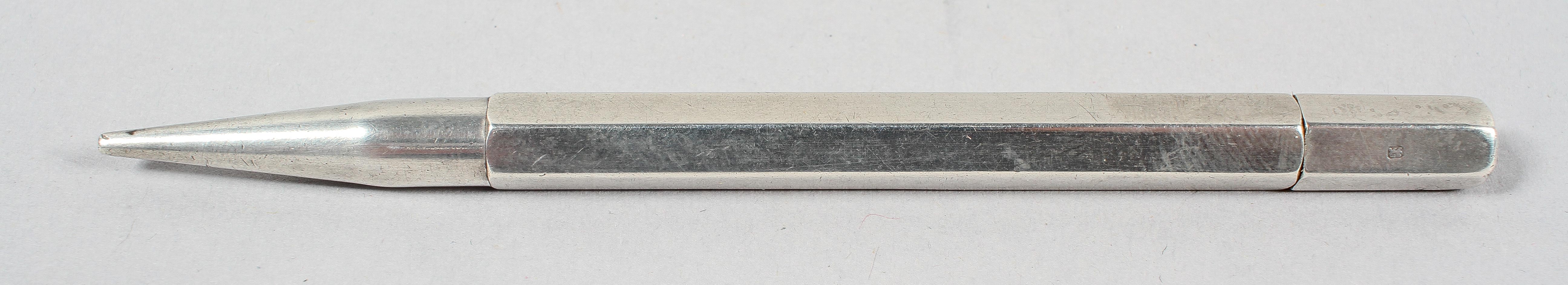 A silver propelling pencil, of plain panel hexagonal form with no clip, London 1947,