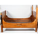 A French Empire style mahogany double bed, probably early 20th century, with turned ball finials,
