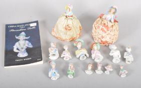 Two early 20th century porcelain pin cushion dolls, and ten other half-dolls and two busts,
