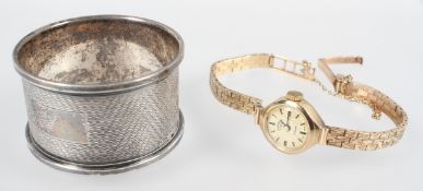 A hallmarked 9ct gold mechanical Rotary wristwatch together with a 25.0mm napkin ring.