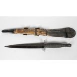 A reproduction FS fighting knife, in scabbard,