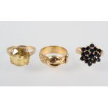 A collection of three rings to include: A single stone citrine ring; A sapphire cluster ring;