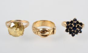 A collection of three rings to include: A single stone citrine ring; A sapphire cluster ring;