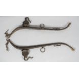 A set of antique horse hames, with brass acorn shaped caps, with chains and hook attachments,