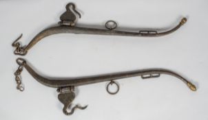 A set of antique horse hames, with brass acorn shaped caps, with chains and hook attachments,