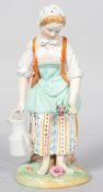 A Dresden porcelain figure of a lady gardener, late 19th century, blue monogram and script mark,