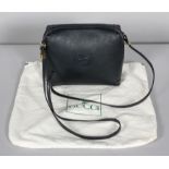 A Gucci navy leather ladies shoulder bag, the textured leather bearing the interlocking G monogram,
