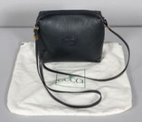 A Gucci navy leather ladies shoulder bag, the textured leather bearing the interlocking G monogram,