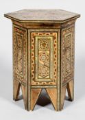 A Syrian marquetry hexagonal section occasional table inlaid in the Middle Eastern style
