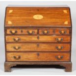 A George III mahogany inlaid bureau,