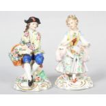 A pair of Sitzendorf figures of a gallant and companion, circa 1900, printed 'crowned blue S marks',