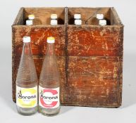 A vintage 20th century wooden crate with twelve empty glass Corona sparkling orangeade and lemonade