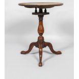 A George III elm small tilt top occasional table, with bird cage gallery above turned baluster stem,