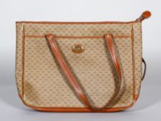 A Gucci leather and monogrammed canvas tote bag,