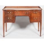 An early 19th century Regency serpentine sideboard with low gallery,