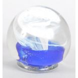 An Isle of Wight Studio Art glass paperweight incised marks, with white and blue spiral inclusions,