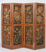 A late 19th century oak three fold room divider with woolwork panels,