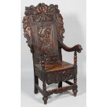 A Victorian carved oak hall chair, in a revival style,